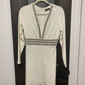 Low cut, mini dress by Venus. Worn only once. Size 8. Very good condition.